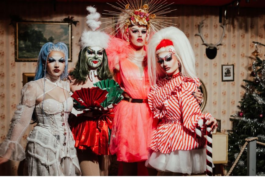 4 people in christmas themed drag